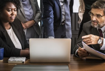 Group of People Looking on Laptop Computer