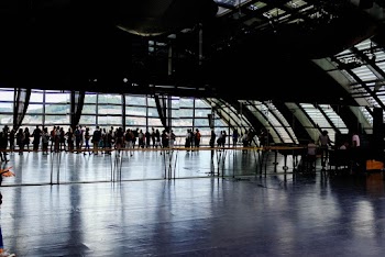 Group of People Near Clear Glass Window