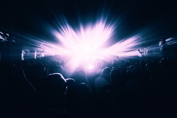group of people near LED light inside room