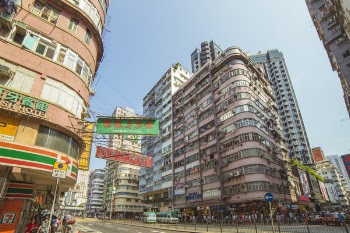 Group of People Near Road and Buildings