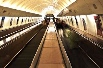 group of people on scallator