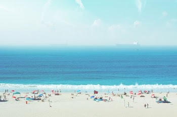 group of people on white sand beach