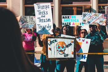 Group of People Rallying Near Building