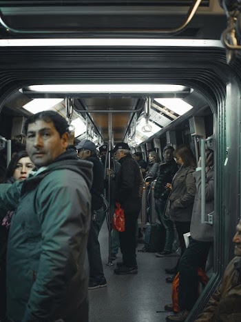 Group of People Riding on Train