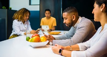 Group of People Sitting Beside Table
