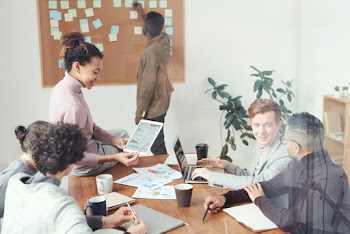 Group of People Sitting Indoors