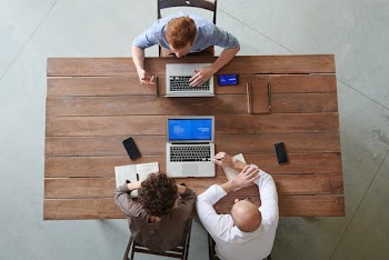 Group of People Sitting Indoors
