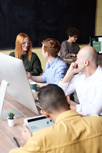 Group of People Sitting Indoors
