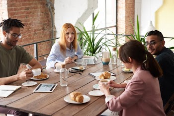 Group of People Sitting Indoors