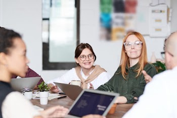 Group of People Sitting Indoors