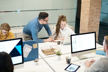 Group of People Sitting Indoors