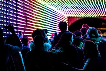 Group of People Sitting on Chair in Dimmed Room