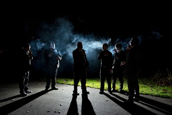 Group of People Smoking Outdoors