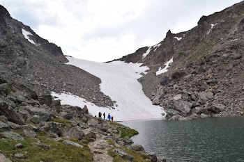 Group Of People Standing Beside Body Of Water