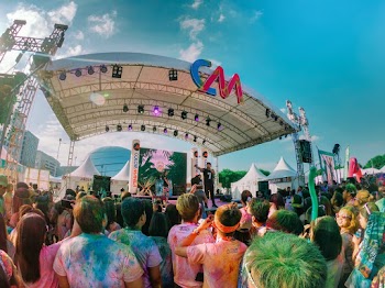 Group of People Standing in Front of CM Stage