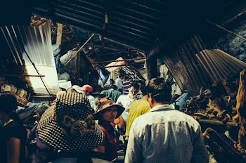 group of people standing inside structure