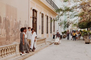 group of people standing near wall