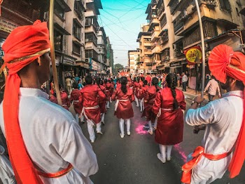 Group Of People Standing On Road