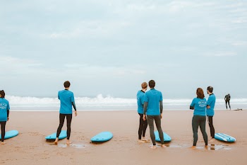 Group of People Standing on Shoreline