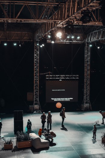 Group of People Standing on Stage