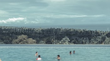 Group of People Swimming in Pool