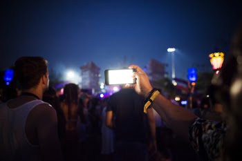 Group of People Using Smartphones during Nighttime