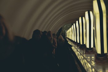 Group of People Walking Inside Hallway