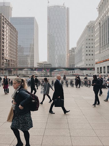 Group of People Walking on Concrete Ground