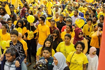 Group of People Wearing Yellow Shirt