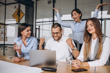 Group of people working out business plan in an office Free Photo
