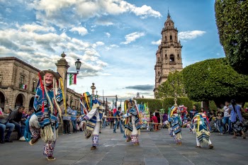 Group of Performers Dancing Near Trees