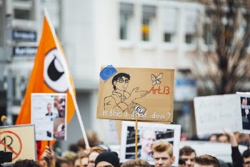 Group of Person Holding Signages