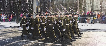 Group of Soldiers Parading on Concrete Road