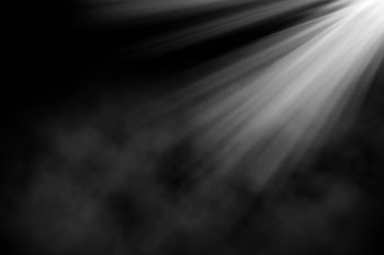 Grunge background with spotlight shining down in smokey atmosphere Free Photo