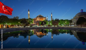 Hagia Sophia Mosque in morning with Turkish flag in Istanbul