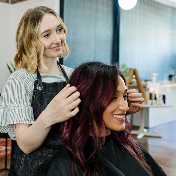 Hairstylist giving a finishing touch to… | Free stock photo | High Resolution image