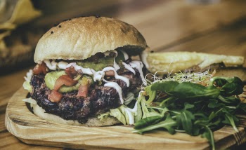 Hamburger on Brown Wooden Chopping Board