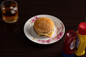 Hamburger on White and Pink Floral Plate