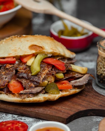 Hamburger with kebab meat, tomato and cucumber Free Photo