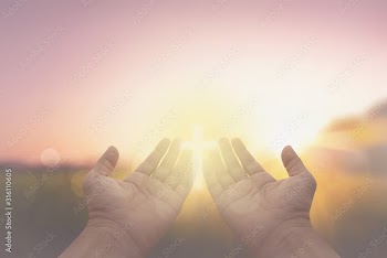 hand and jesus at sunrise nature background