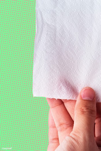 Hand getting toilet paper on pink and green background | Free  photo - 2312534