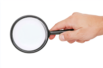 Hand Holding a Black Magnifying Glass