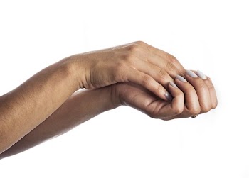 Hand Holding Another