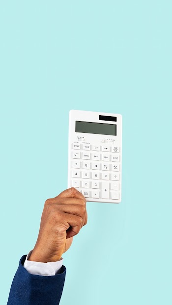 Hand holding calculator in finance concept | Free stock photo | High Resolution image