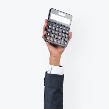 Hand holding calculator in finance concept | Free stock photo | High Resolution image