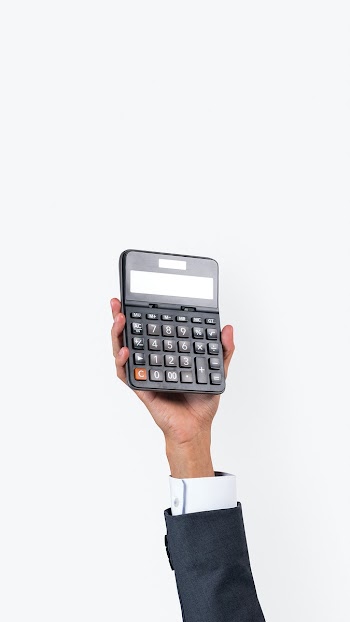 Hand holding calculator in finance concept | Free stock photo | High Resolution image