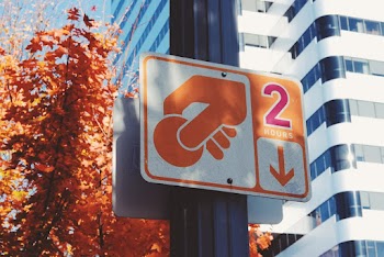 Hand Holding Coin Signage