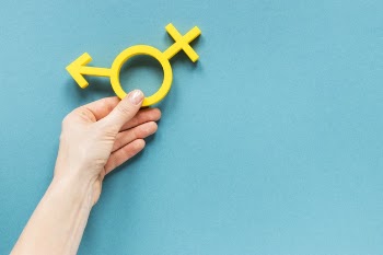 Hand holding colorful equality symbol Free Photo