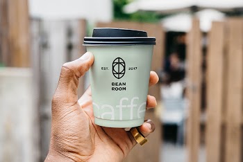 Hand Holding Cup Mockup