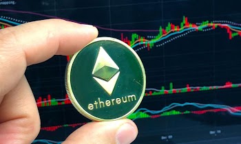 Hand Holding Ethereum Coin on Stock Market Background